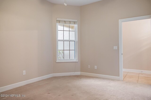 carpeted empty room with a wealth of natural light