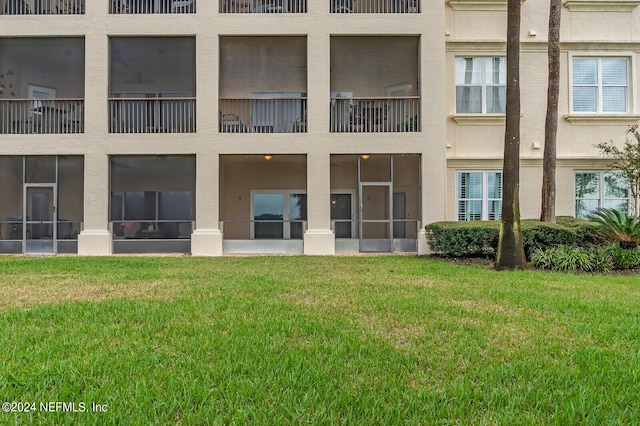 13846 Atlantic Blvd Unit 902, Jacksonville, FL 32225 - rear view of house featuring a yard