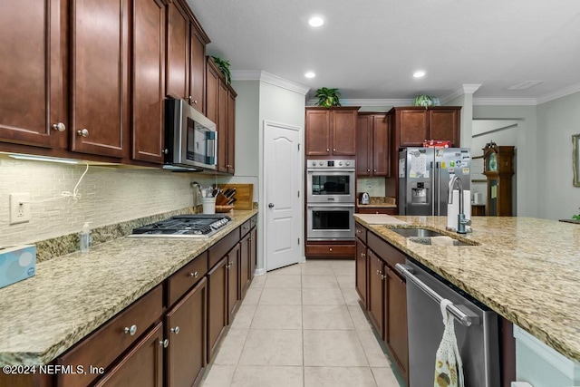 kitchen featuring backsplash, sink, stainless steel appliances, light tile floors, and ornamental molding