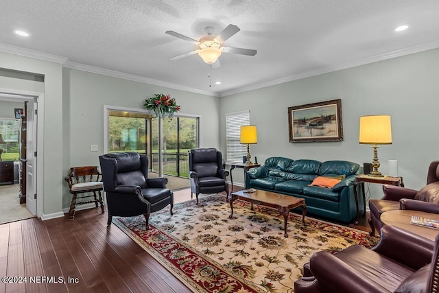 living room with crown molding, dark hardwood / wood-style flooring, a textured ceiling, and ceiling fan