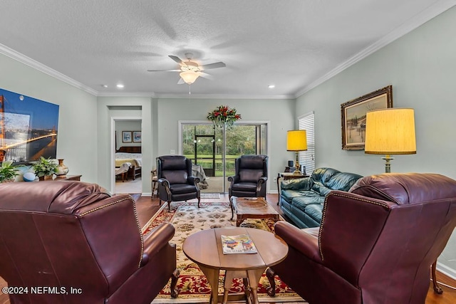 living room with crown molding, a textured ceiling, ceiling fan, and hardwood / wood-style flooring