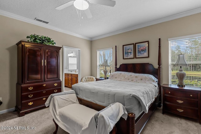 carpeted bedroom featuring a textured ceiling, ceiling fan, ensuite bathroom, and ornamental molding