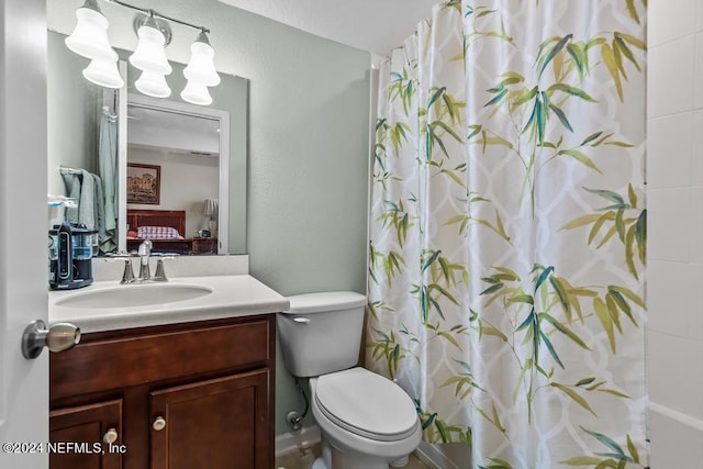 bathroom featuring toilet and vanity