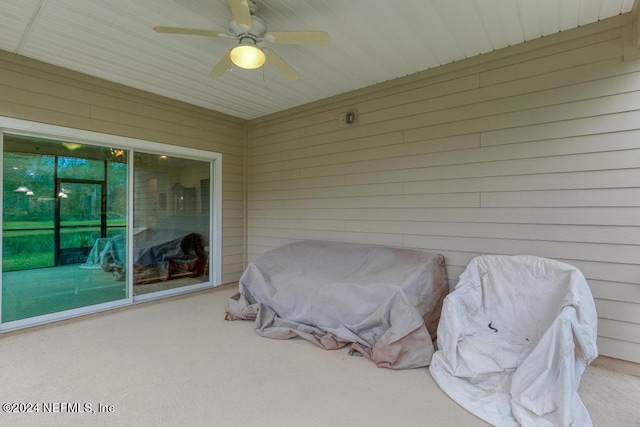 exterior space with ceiling fan