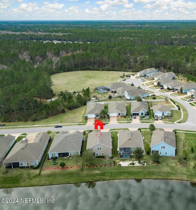 birds eye view of property featuring a water view