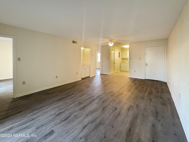 interior space featuring ceiling fan and dark hardwood / wood-style floors