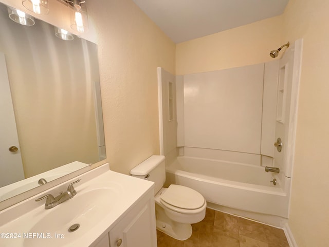 full bathroom featuring toilet, vanity, washtub / shower combination, and tile flooring