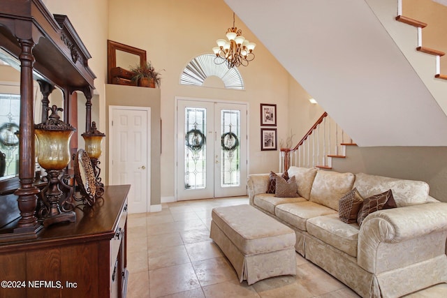 living room featuring stairs, high vaulted ceiling, french doors, and an inviting chandelier