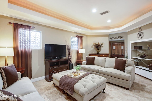 living area featuring recessed lighting, a raised ceiling, visible vents, ornamental molding, and baseboards