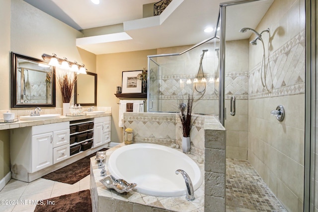 bathroom featuring tile patterned floors, vanity, and independent shower and bath