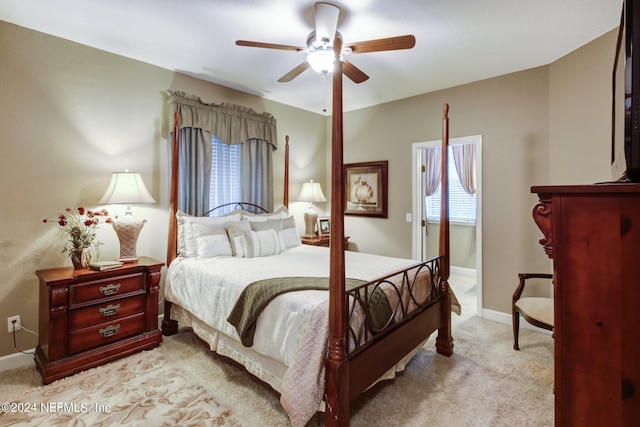 bedroom featuring light carpet and ceiling fan