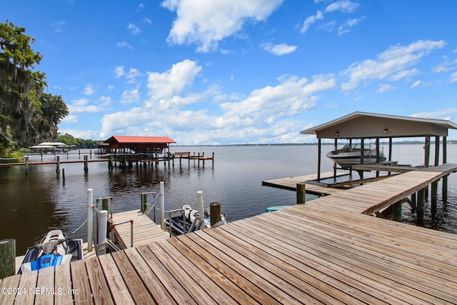 view of dock featuring a water view and boat lift