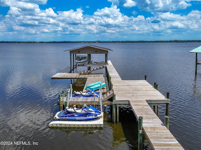 view of dock with a water view and boat lift