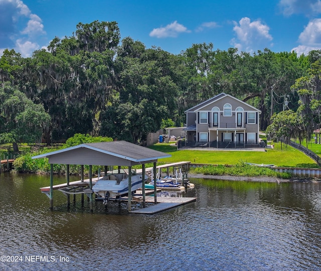 dock area featuring a water view, a balcony, and a lawn