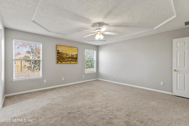 carpeted empty room with a textured ceiling and ceiling fan