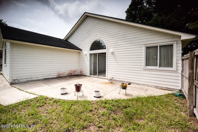 back of property featuring a patio area