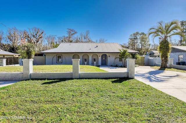 view of front of home with a front yard