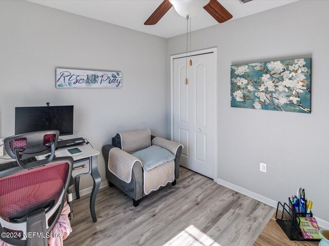 office space with hardwood / wood-style flooring and ceiling fan