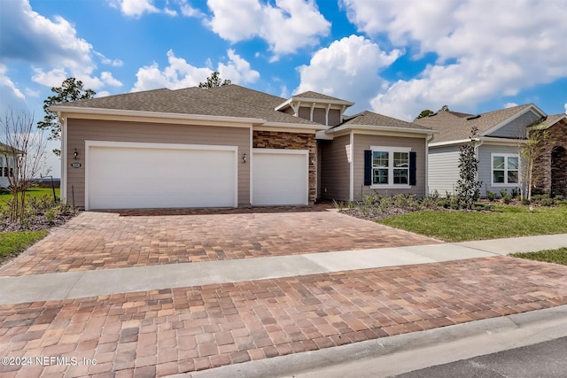 view of front of property with a garage