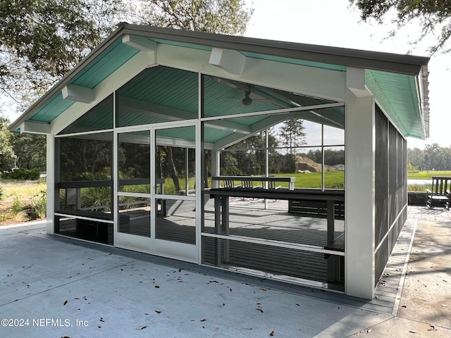 view of community with a water view and a carport