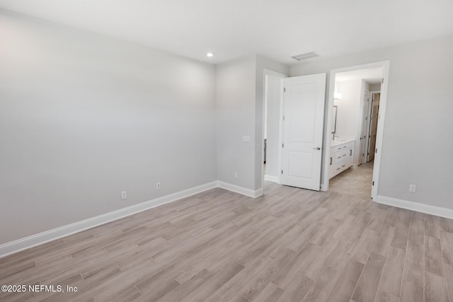 unfurnished bedroom featuring recessed lighting, light wood-type flooring, visible vents, and baseboards