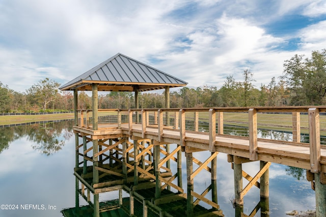 dock area with a gazebo and a water view