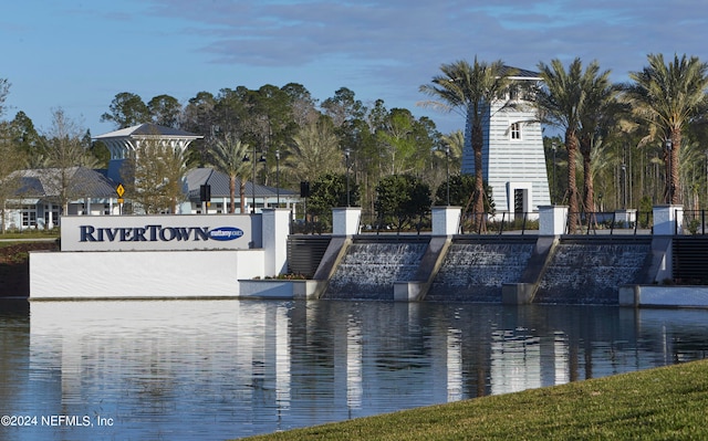 view of community with a water view