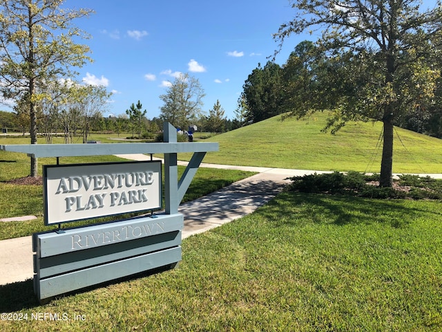 view of community featuring a lawn