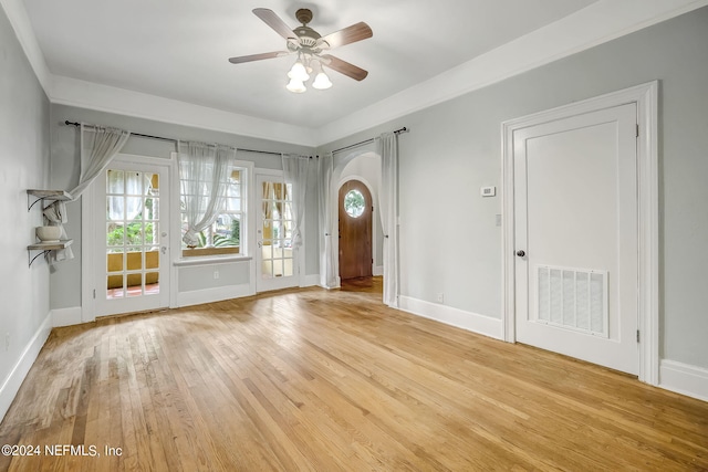 foyer featuring ceiling fan and light wood-type flooring