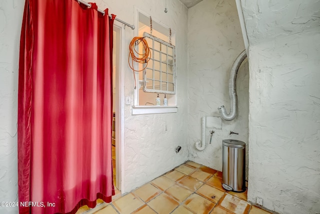 bathroom with tile flooring