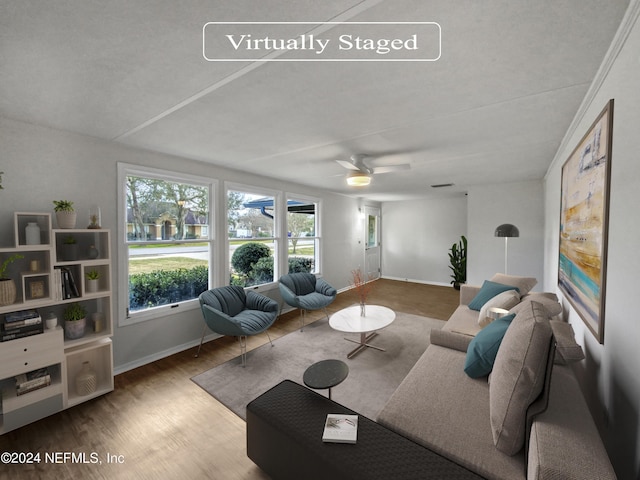 living room featuring hardwood / wood-style flooring and ceiling fan