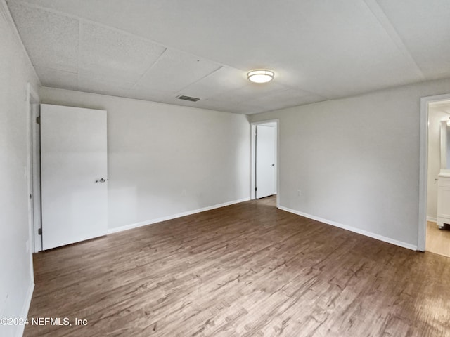 unfurnished room featuring wood-type flooring