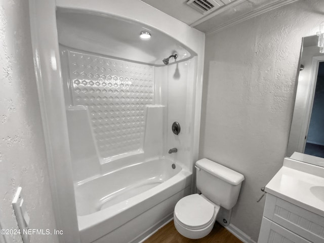 full bathroom with vanity, wood-type flooring, shower / bathtub combination, and toilet