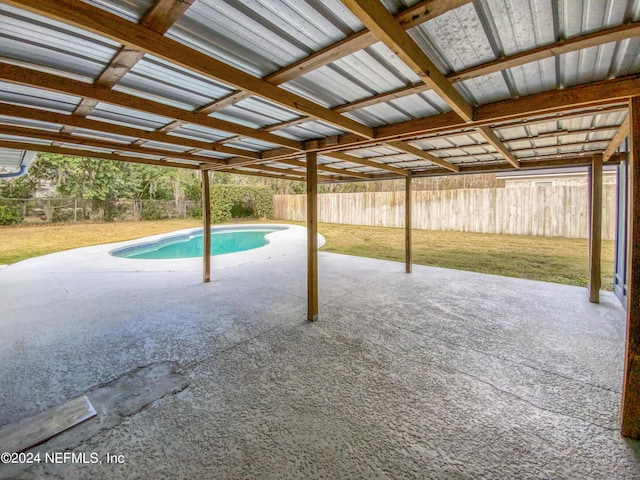 view of pool featuring a yard and a patio