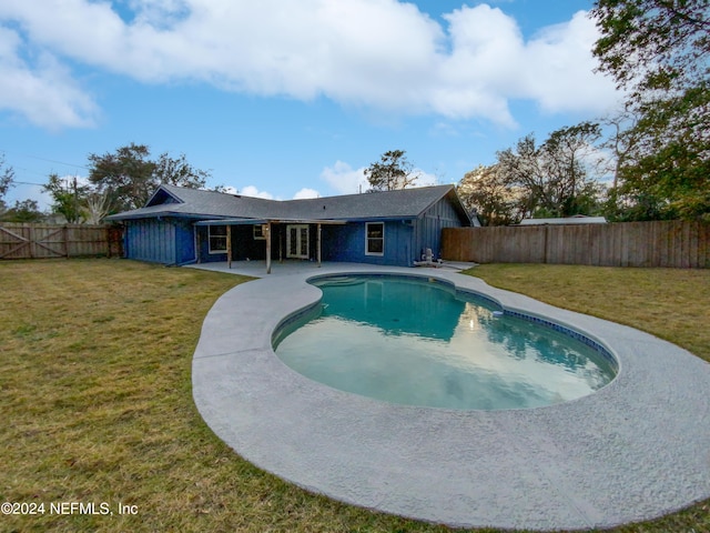 view of pool with a yard and a patio area