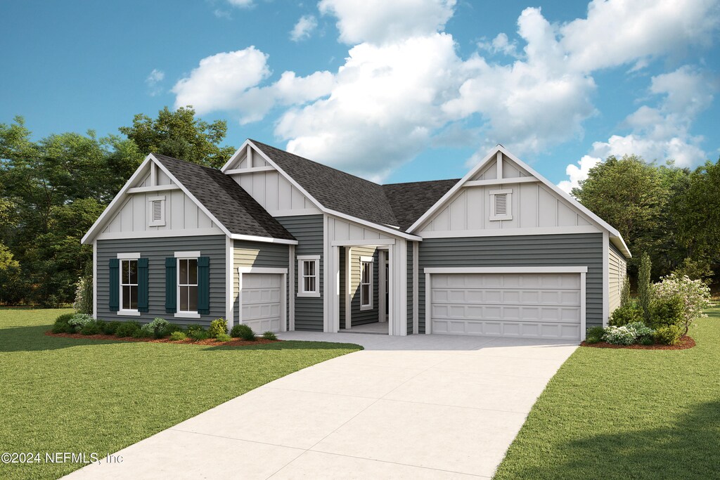 view of front facade with a front yard and a garage