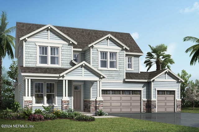 view of front of property featuring a front yard, a garage, and covered porch