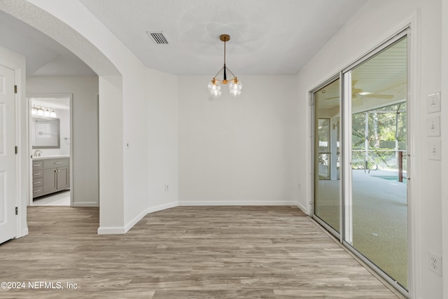 unfurnished dining area with light hardwood / wood-style flooring