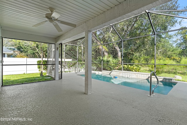 view of pool with a patio, ceiling fan, and a lanai