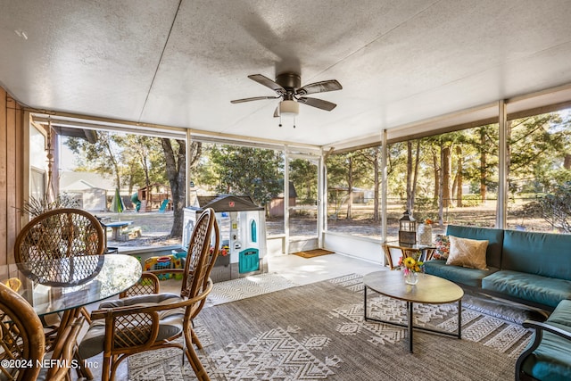 sunroom featuring ceiling fan