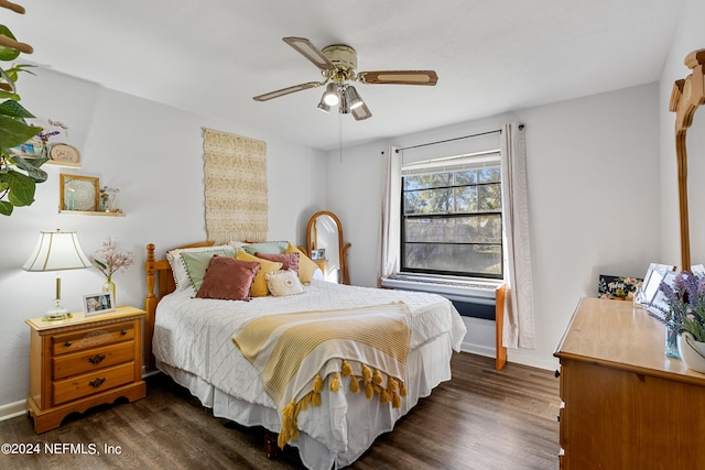 bedroom featuring dark hardwood / wood-style flooring and ceiling fan