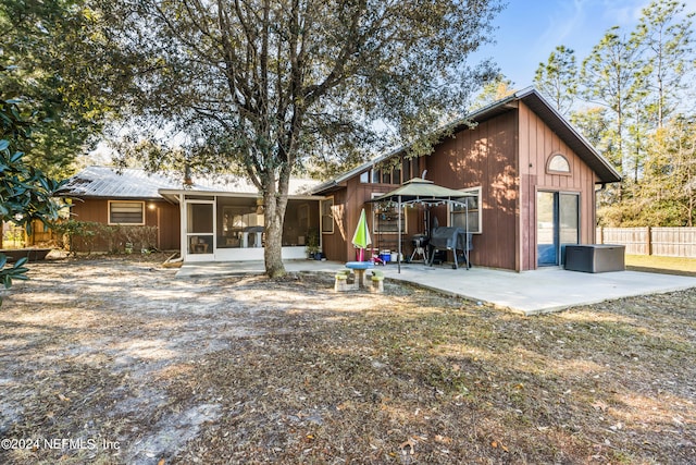 rear view of house featuring a patio area