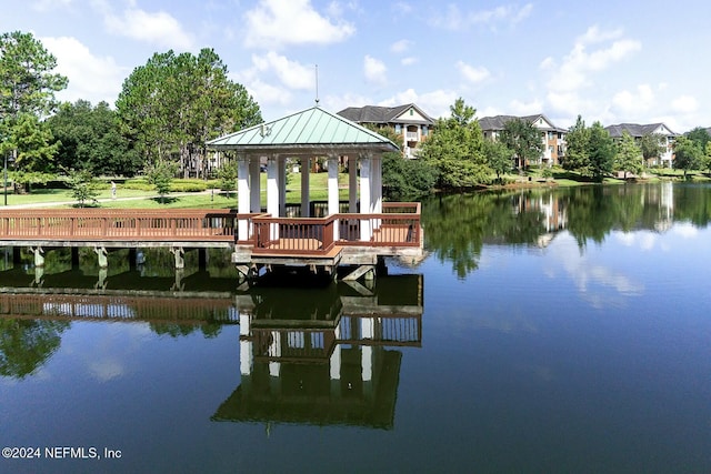 dock area with a gazebo and a water view