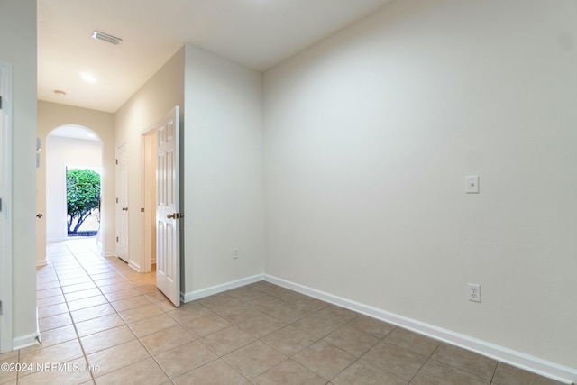 empty room with light tile patterned floors