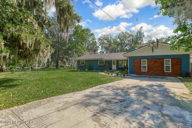 ranch-style home with a front lawn