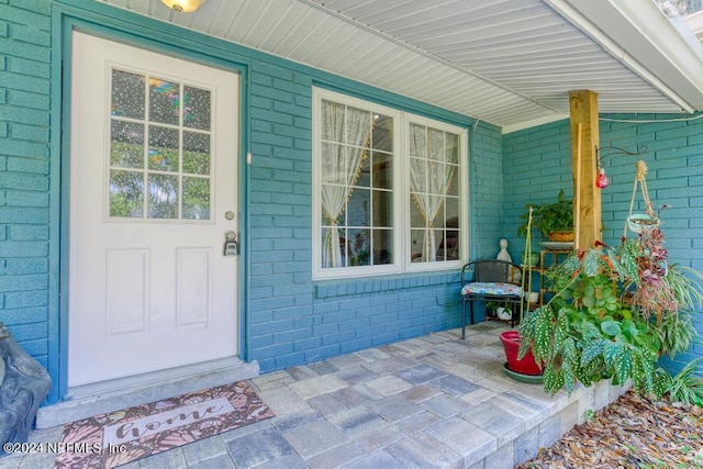 doorway to property featuring a porch