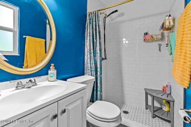 bathroom featuring toilet, tile floors, oversized vanity, and a shower with curtain