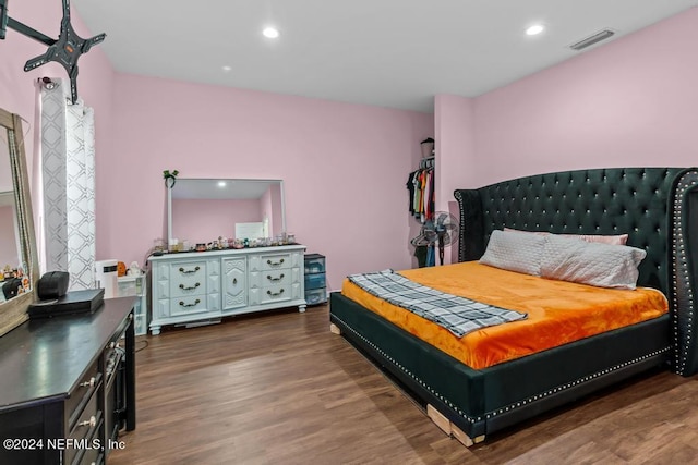 bedroom featuring dark hardwood / wood-style flooring