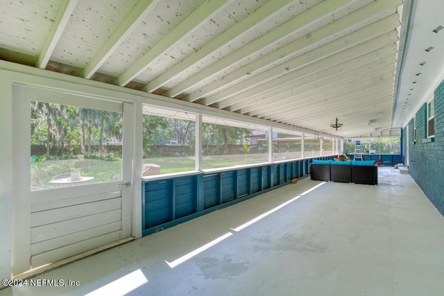 unfurnished sunroom with vaulted ceiling