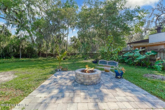 view of patio / terrace with an outdoor fire pit